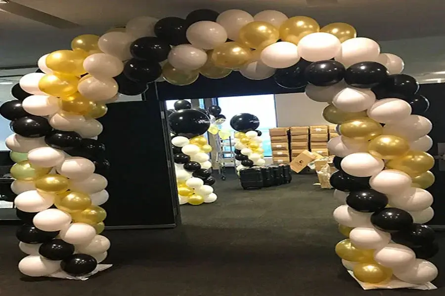 Custom balloon décor doorway arch in Kansas City event space